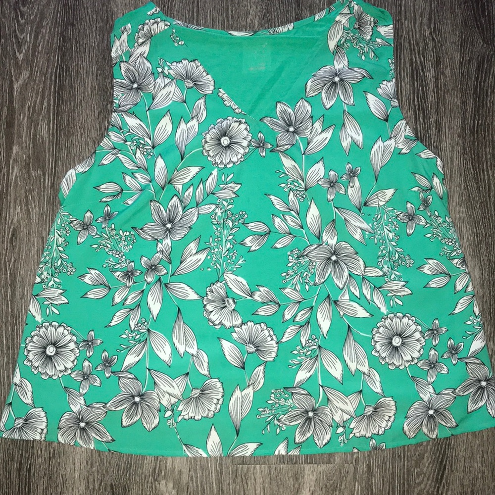 Green and white floral blouse